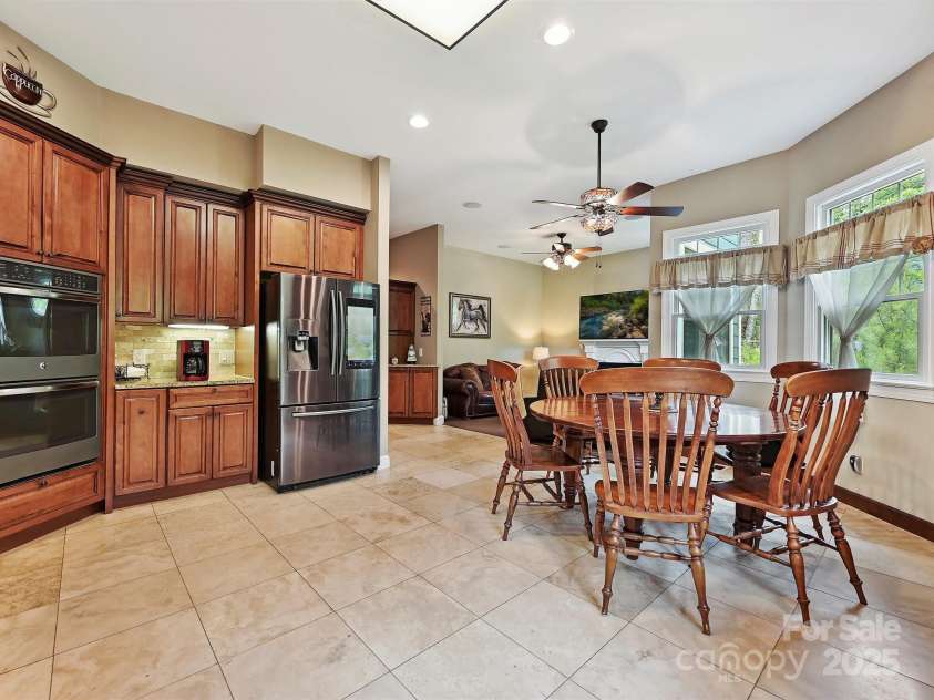1140 Fern Hill Road, Mooresville, NC 28117.  MLS# CAR4255290, YatesRealty ID 12085. Kitchen w granite counters, stainless appliances, double oven, microwaveKitchen with granite counters, lots of cabinets