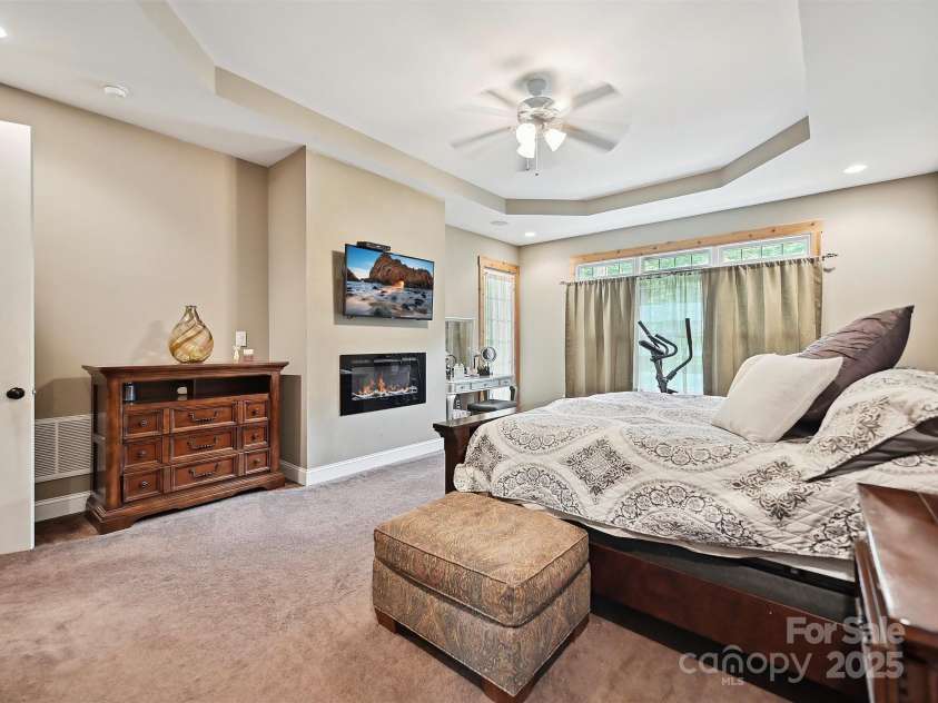 1140 Fern Hill Road, Mooresville, NC 28117.  MLS# CAR4255290, YatesRealty ID 12085. Pimary suite retreat with  fireplace, access to covered back porch.