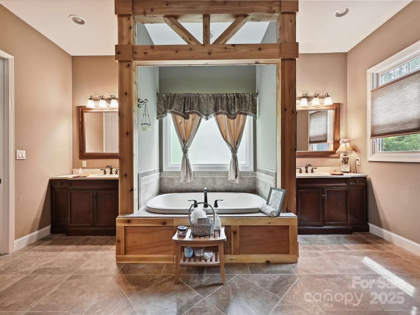 1140 Fern Hill Road, Mooresville, NC 28117.  MLS# CAR4255290, YatesRealty ID 12085. Primary bath with his and her vanities.