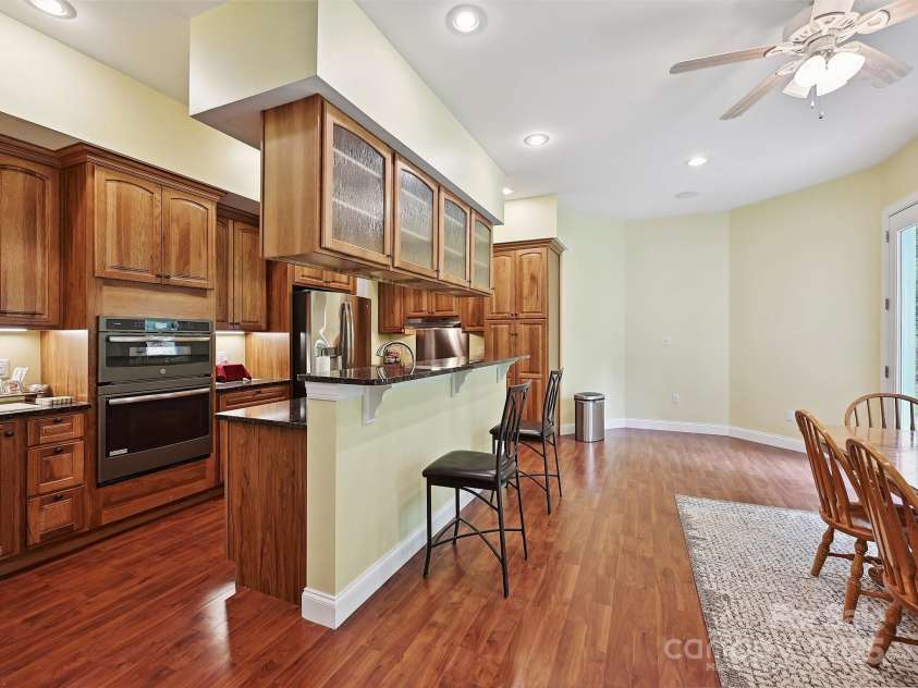 1140 Fern Hill Road, Mooresville, NC 28117.  MLS# CAR4255290, YatesRealty ID 12085. Spacious basement kitchen with stainless appliances, open eat-in area.