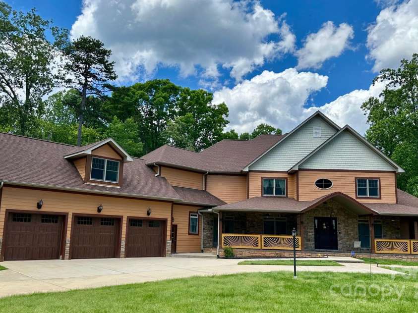 1140 Fern Hill Road, Mooresville, NC 28117.  MLS# CAR4255290, YatesRealty ID 12085. This estate has over 7000 sq st on 1.8 acres