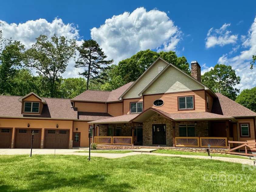 1140 Fern Hill Road, Mooresville, NC 28117.  MLS# CAR4255290, YatesRealty ID 12085. Wide and open front yard with private wooded back lot