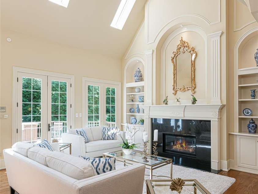 2005 Viburnum Lane, Asheville, NC 28803.  MLS# CAR4151623, YatesRealty ID 12090. Light-filled LR offers an electronic system to raise and lower the light fixtures for design options and cleaning.