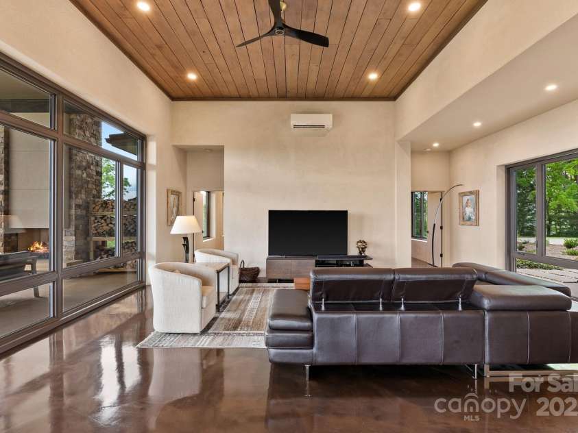 1045 & 1047 Graham Road, Marshall, NC 28753.  MLS# CAR4280943, YatesRealty ID 121. Living room  - all interior walls are artisnal plaster