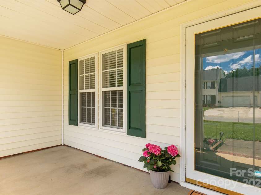 9916 Meadowmead Court, Charlotte, NC 28273.  MLS# CAR4251575, YatesRealty ID 12102. Functional front porch perfect for a swing or rocking chairs