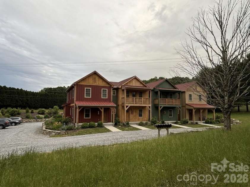 140 Wilson Ridge Road, Boone, NC 28607.  MLS# CAR4368522, YatesRealty ID 12103. AI generated possibilities on leveled acreage.