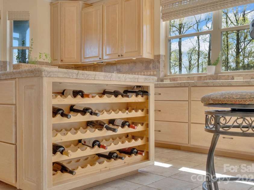 246 Pinnacle Mountain Road, Zirconia, NC 28790.  MLS# CAR4249618, YatesRealty ID 12104. Built-in wine rack in kitchen, lights up in a variety of colors (you pick the color you want).
