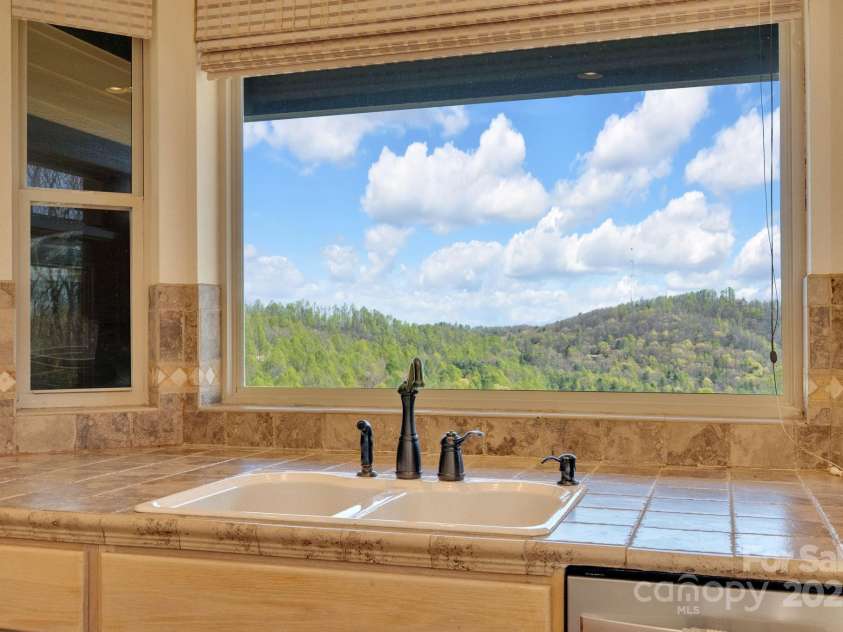 246 Pinnacle Mountain Road, Zirconia, NC 28790.  MLS# CAR4249618, YatesRealty ID 12104. Check out that mountain view from the kitchen window!