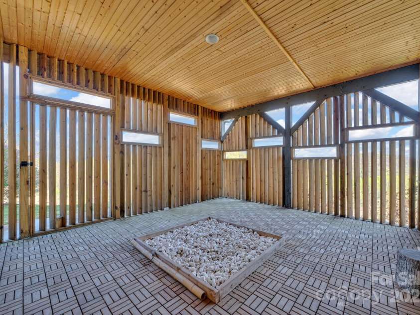 246 Pinnacle Mountain Road, Zirconia, NC 28790.  MLS# CAR4249618, YatesRealty ID 12104. Private entertainment or yoga area located next to the covered entertainment space