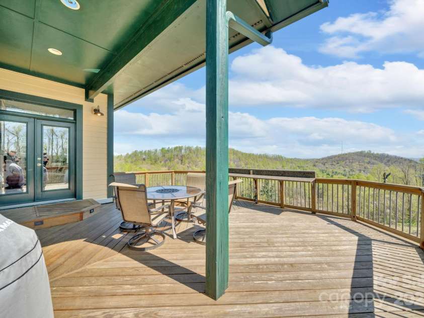 246 Pinnacle Mountain Road, Zirconia, NC 28790.  MLS# CAR4249618, YatesRealty ID 12104. Spacious back deck, partially covered; perfect for entertaining and taking in the mountain views