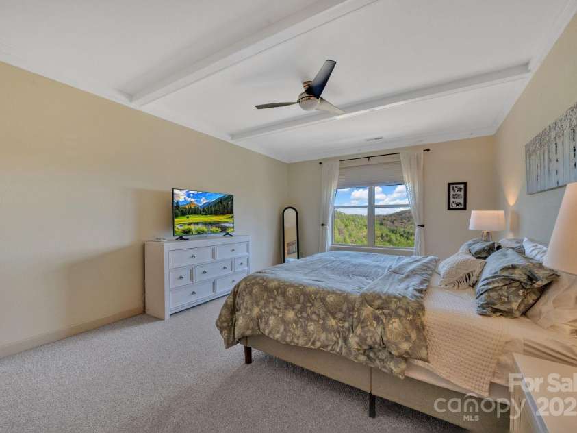 246 Pinnacle Mountain Road, Zirconia, NC 28790.  MLS# CAR4249618, YatesRealty ID 12104. Spacious primary bedroom, located on main level