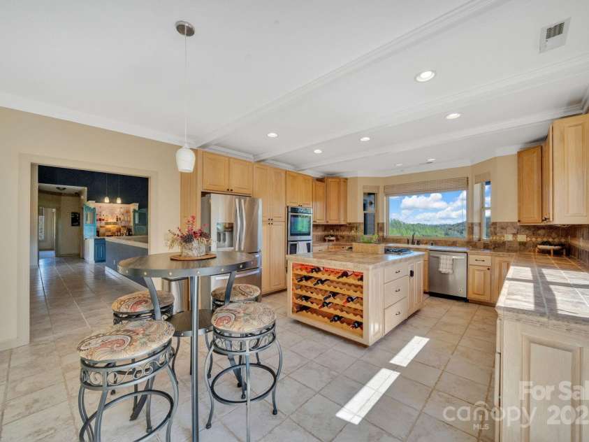 246 Pinnacle Mountain Road, Zirconia, NC 28790.  MLS# CAR4249618, YatesRealty ID 12104. View from corner of the kitchen looking to the back of the home