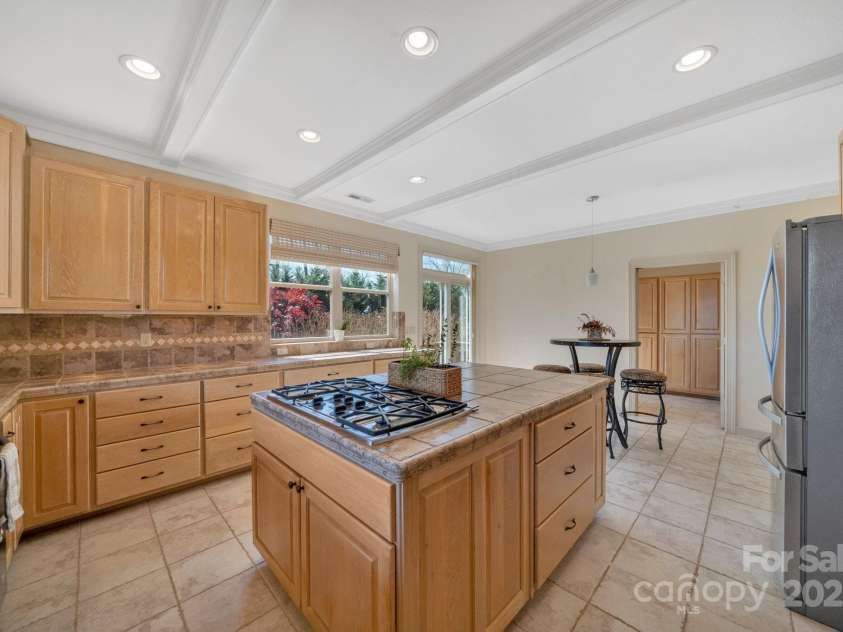 246 Pinnacle Mountain Road, Zirconia, NC 28790.  MLS# CAR4249618, YatesRealty ID 12104. View from corner of the kitchen looking to the laundry room, ample storage and cabinets
