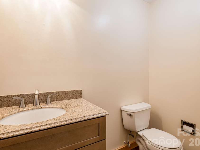 55 Glade Lane, Black Mountain, NC 28711.  MLS# CAR4369029, YatesRealty ID 12105. Half Bath off Living Room