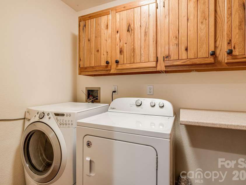55 Glade Lane, Black Mountain, NC 28711.  MLS# CAR4369029, YatesRealty ID 12105. Laundry Room off Kitchen