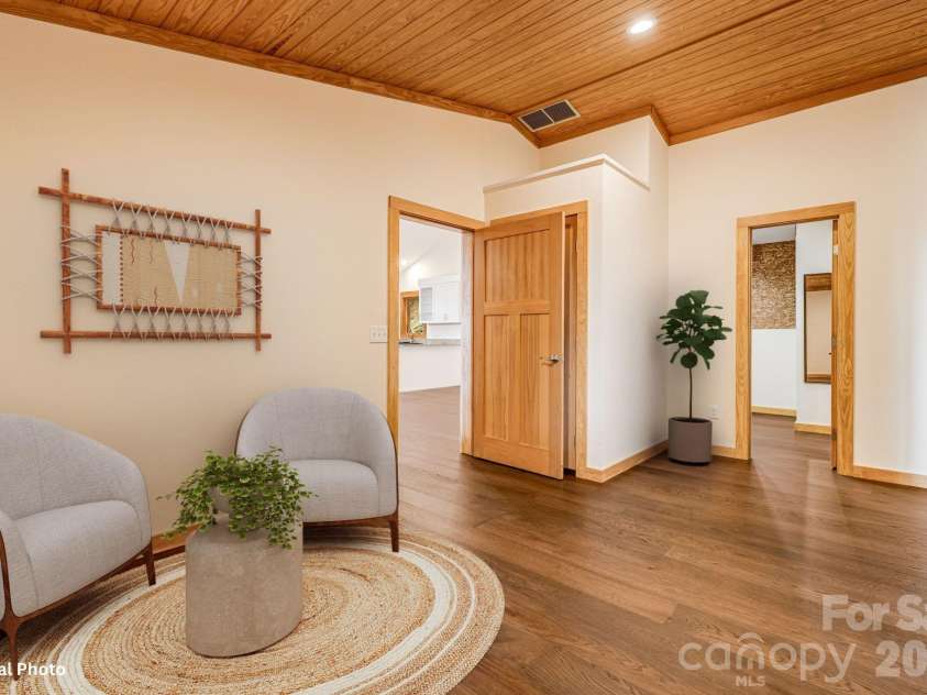 55 Glade Lane, Black Mountain, NC 28711.  MLS# CAR4369029, YatesRealty ID 12105. Sitting Room in Primary with Virtual Staging