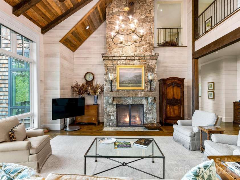 616 Old Growth Forest Road, Burnsville, NC 28714.  MLS# CAR4076276, YatesRealty ID 12106. Can't you just feel the warmth coming from that floor-to-ceiling stacked stone fireplace?