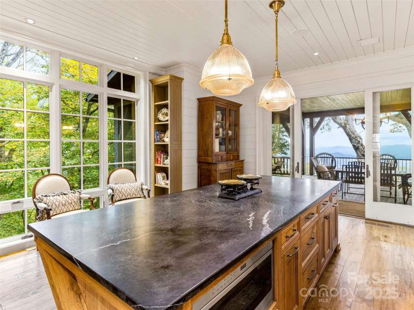 616 Old Growth Forest Road, Burnsville, NC 28714.  MLS# CAR4076276, YatesRealty ID 12106. Speaking of views, note the convenient adjacency of the kitchen to the amazing deck