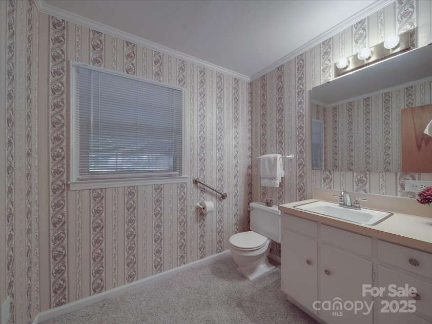 2213 Milton Road, Charlotte, NC 28215.  MLS# CAR4255190, YatesRealty ID 12108. 1/2 bath has natural light through window at rear