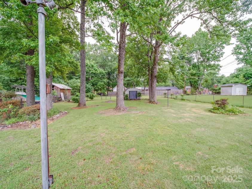 2213 Milton Road, Charlotte, NC 28215.  MLS# CAR4255190, YatesRealty ID 12108. Deep, level rear yard has been lovingly curated