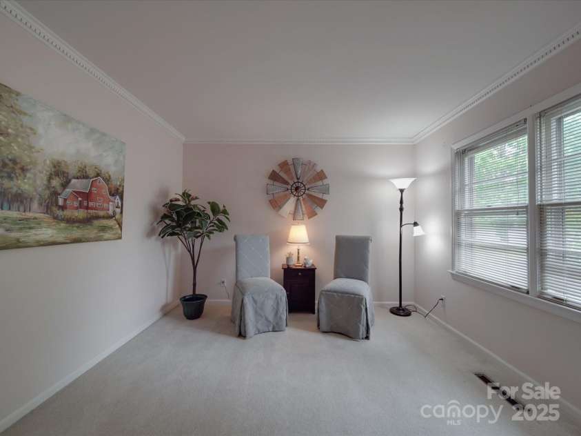 2213 Milton Road, Charlotte, NC 28215.  MLS# CAR4255190, YatesRealty ID 12108. Formal living room is flooded with natural light