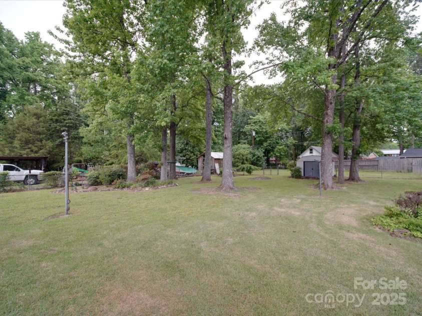 2213 Milton Road, Charlotte, NC 28215.  MLS# CAR4255190, YatesRealty ID 12108. Lovely deep view of level rear yard