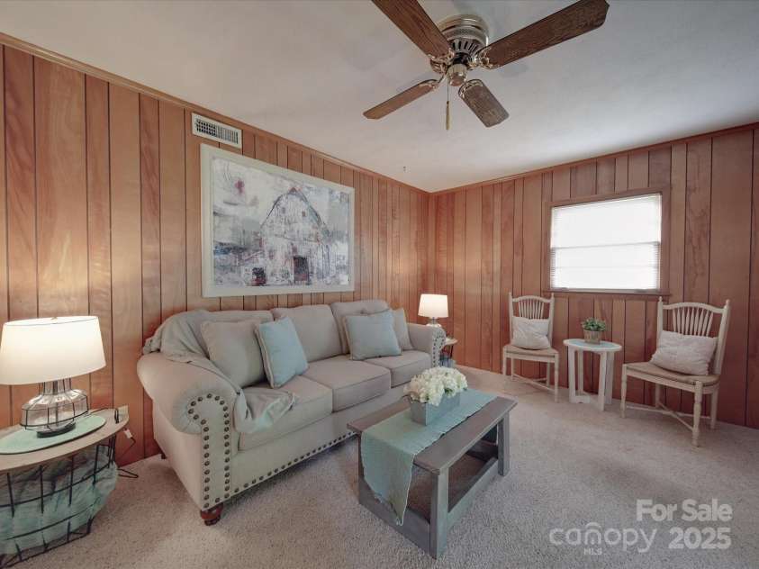 2213 Milton Road, Charlotte, NC 28215.  MLS# CAR4255190, YatesRealty ID 12108. Original paneling in cozy den