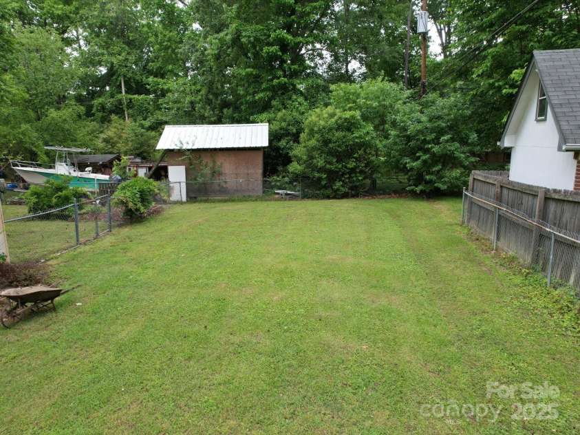 2213 Milton Road, Charlotte, NC 28215.  MLS# CAR4255190, YatesRealty ID 12108. This area gets lots of sun light and served as a rich source of gardening for the family for decades
