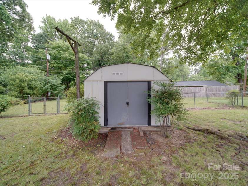 2213 Milton Road, Charlotte, NC 28215.  MLS# CAR4255190, YatesRealty ID 12108. Tool shed with ramp for riding mower