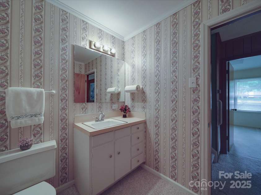 2213 Milton Road, Charlotte, NC 28215.  MLS# CAR4255190, YatesRealty ID 12108. View of 1/2 bath toward fourth bedroom opening