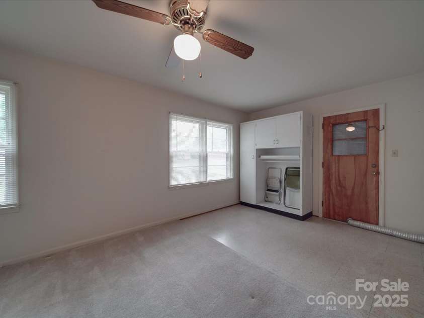 2213 Milton Road, Charlotte, NC 28215.  MLS# CAR4255190, YatesRealty ID 12108. View of cabinet in fourth bedroom and side door options for private patio or to accommodate becoming a short term rental option