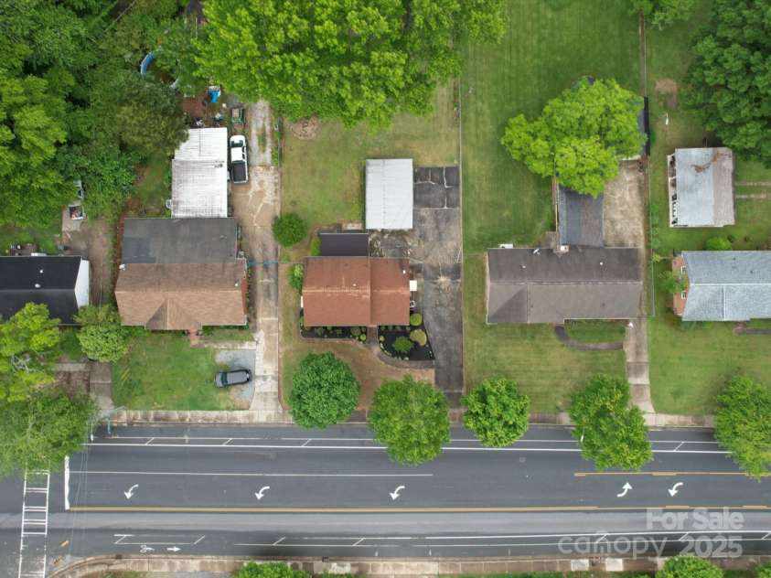 2213 Milton Road, Charlotte, NC 28215.  MLS# CAR4255190, YatesRealty ID 12108. View overhead shows mature trees and landscaping