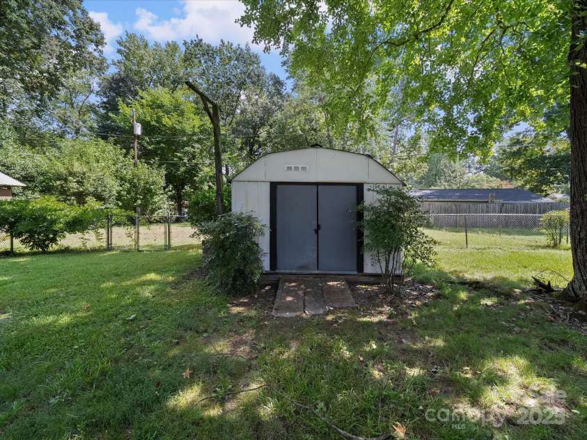 2213 Milton Road, Charlotte, NC 28215.  MLS# CAR4326281, YatesRealty ID 12108. A storage building for outdoor equipment conveys
