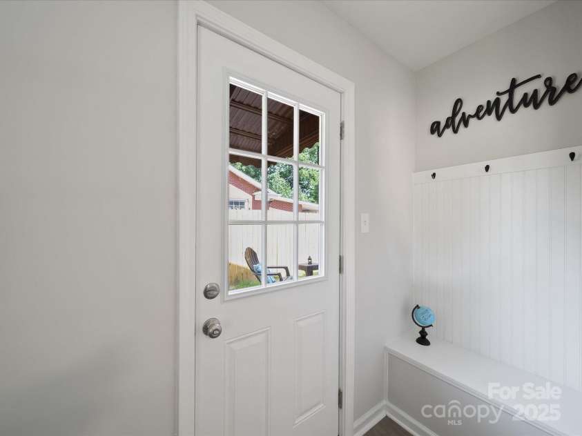 2213 Milton Road, Charlotte, NC 28215.  MLS# CAR4326281, YatesRealty ID 12108. Drop zone off courtyard at side of home