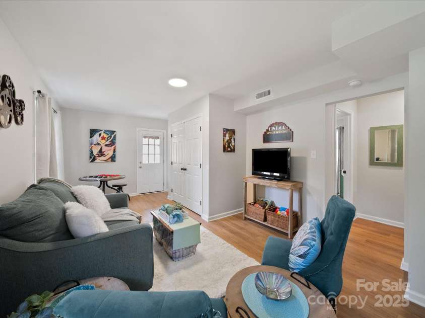 2213 Milton Road, Charlotte, NC 28215.  MLS# CAR4326281, YatesRealty ID 12108. Family room space can be used for multiple purposes, including movie nights, office space, or game night!