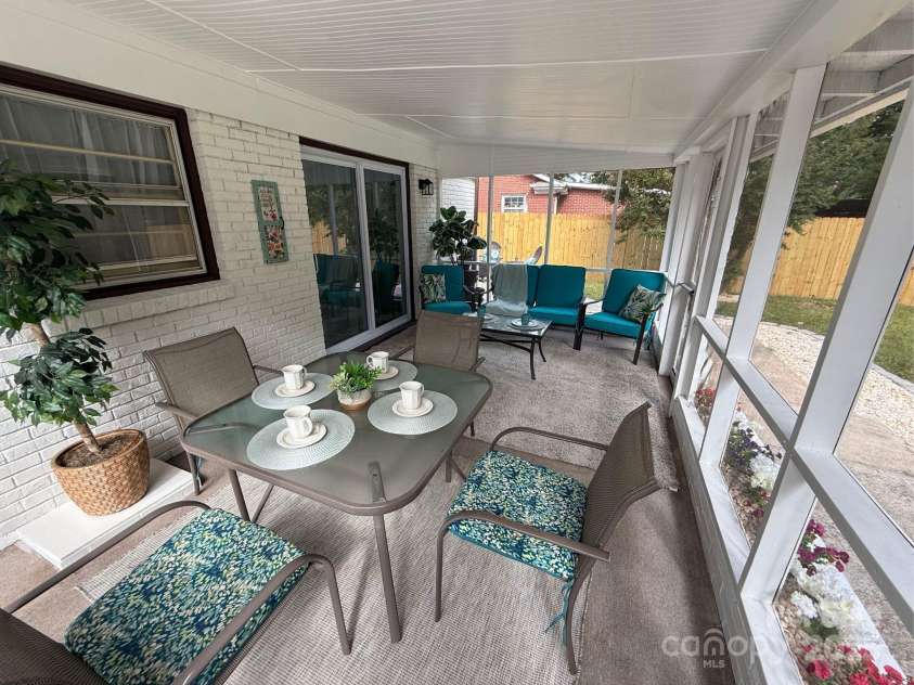 2213 Milton Road, Charlotte, NC 28215.  MLS# CAR4326281, YatesRealty ID 12108. Rear porch overlooks a deep, mature landscaped yard