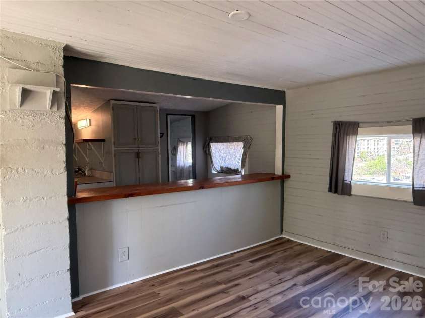 5A Warren Avenue, Asheville, NC 28803.  MLS# CAR4368557, YatesRealty ID 12112. Living Room & Kitchen Bar