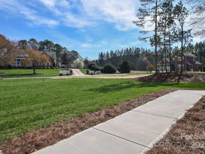 1202 Louise Lane, Albemarle, NC 28001.  MLS# CAR4280888, YatesRealty ID 12113. Sidewalk
