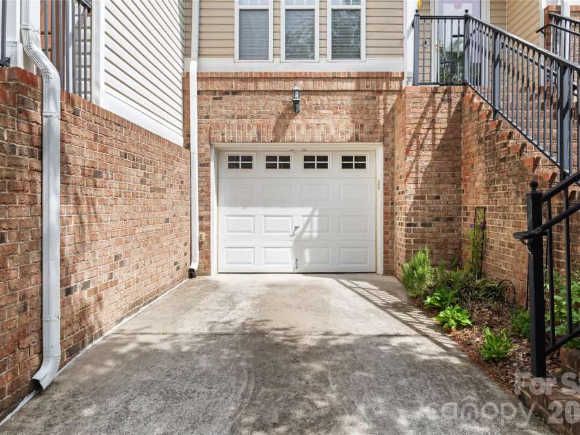 7111 Founders Club Court, Charlotte, NC 28269.  MLS# CAR4370503, YatesRealty ID 12118. 1 car garage has plenty of storage space