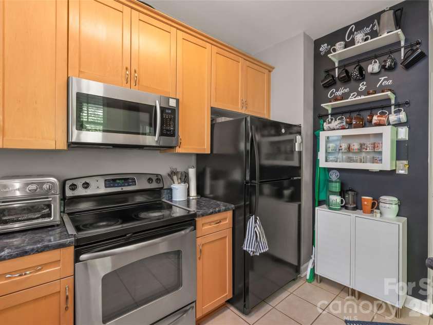 7111 Founders Club Court, Charlotte, NC 28269.  MLS# CAR4370503, YatesRealty ID 12118. Kitchen appliances and coffee bar