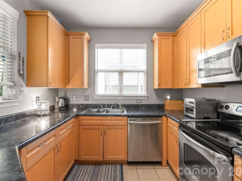 7111 Founders Club Court, Charlotte, NC 28269.  MLS# CAR4370503, YatesRealty ID 12118. Lots of cabinets and countertops