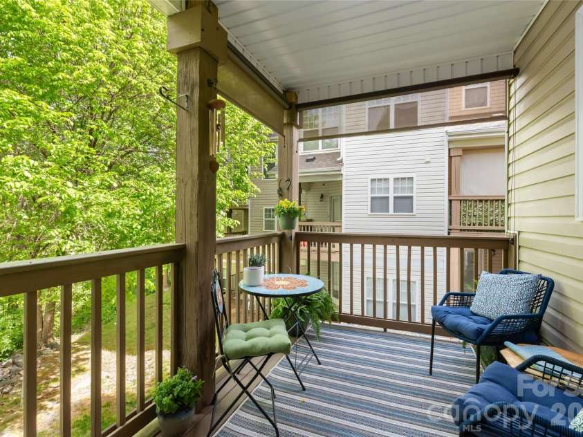7111 Founders Club Court, Charlotte, NC 28269.  MLS# CAR4370503, YatesRealty ID 12118. Main level deck with retractable shades