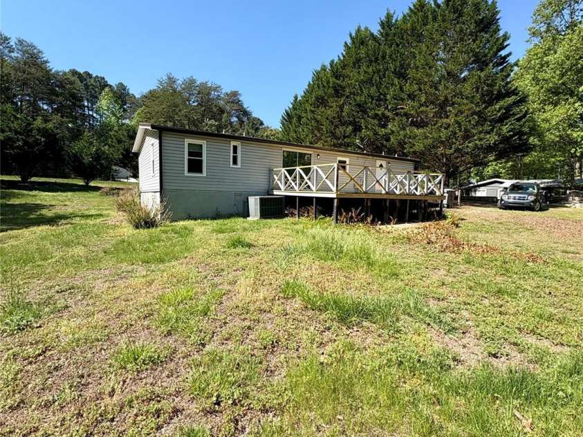 5022 Wrenn Drive, Denver, NC 28037.  MLS# CAR4370723, YatesRealty ID 12129. Back of home with deck