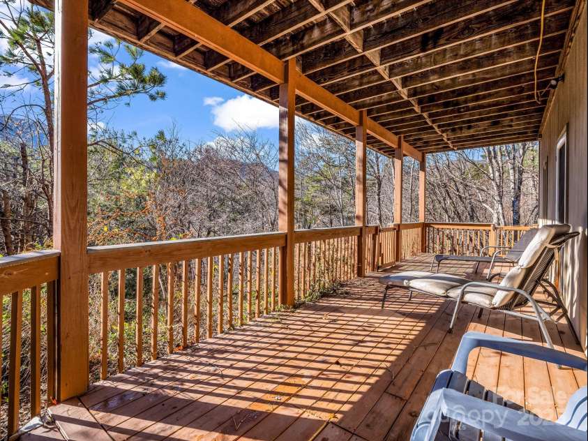 294 Ridgeway Road, Lake Lure, NC 28746.  MLS# CAR4205021, YatesRealty ID 1215. Deck area off the lower level family room.