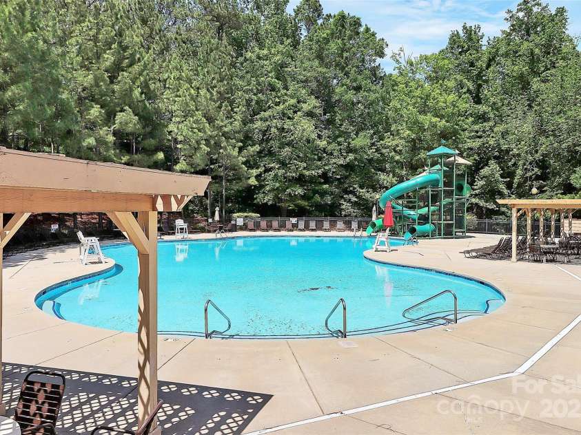 9157 Snow Hill Court, Charlotte, NC 28269.  MLS# CAR4256866, YatesRealty ID 12163. Pool with slides
