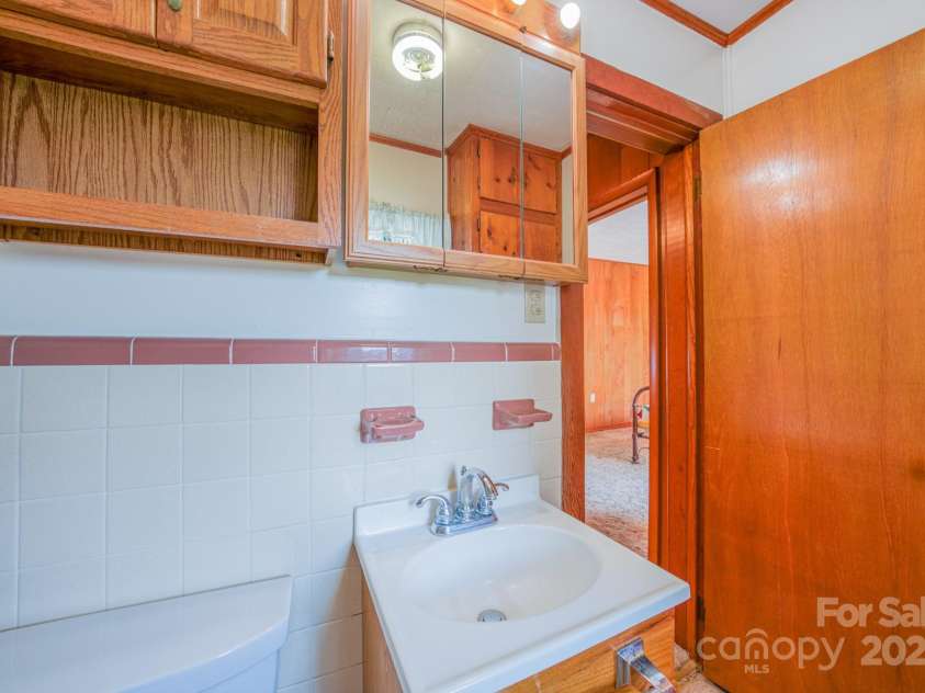 502 and  504 Old US 19 23 Highway, Candler, NC 28715.  MLS# CAR4164132, YatesRealty ID 12166. Bathroom
