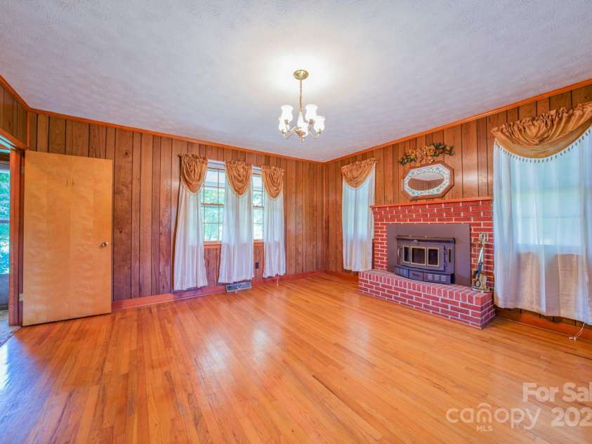 502 and  504 Old US 19 23 Highway, Candler, NC 28715.  MLS# CAR4164132, YatesRealty ID 12166. Downstair bedroom on the left