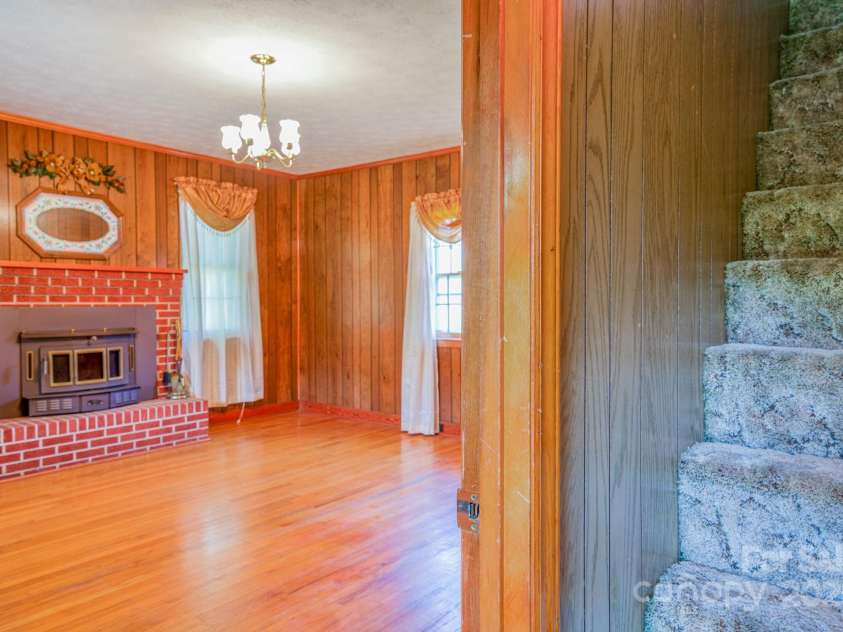 502 and  504 Old US 19 23 Highway, Candler, NC 28715.  MLS# CAR4164132, YatesRealty ID 12166. Downstairs bedroom on left when entering the home
