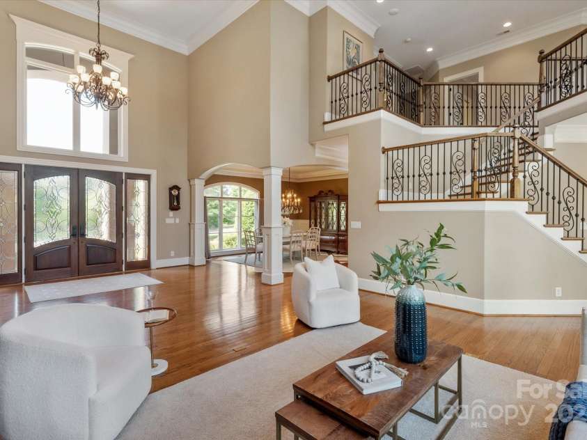 8904 Woodhall Lake Drive, Waxhaw, NC 28173.  MLS# CAR4253927, YatesRealty ID 12169. Living Room Looking Towards Entry and Formal Dining Room