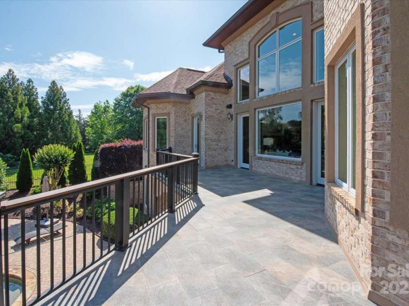 8904 Woodhall Lake Drive, Waxhaw, NC 28173.  MLS# CAR4253927, YatesRealty ID 12169. Rear Balcony Overlooking Pool